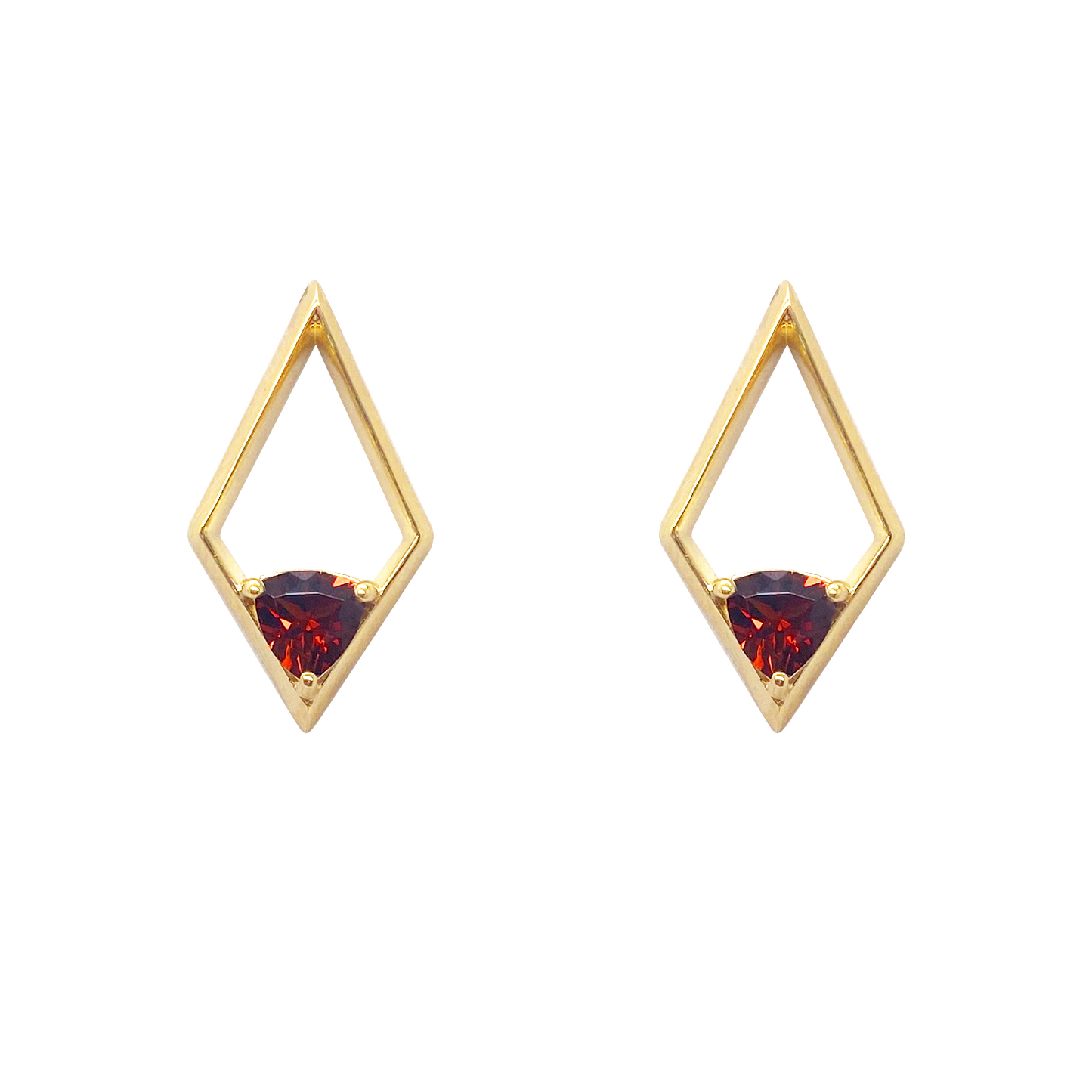 Pair of gold stud earrings with a triangular shape and a red gemstone in the center on a white background.