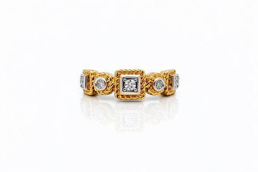 Gold ring with diamond accents on a white background