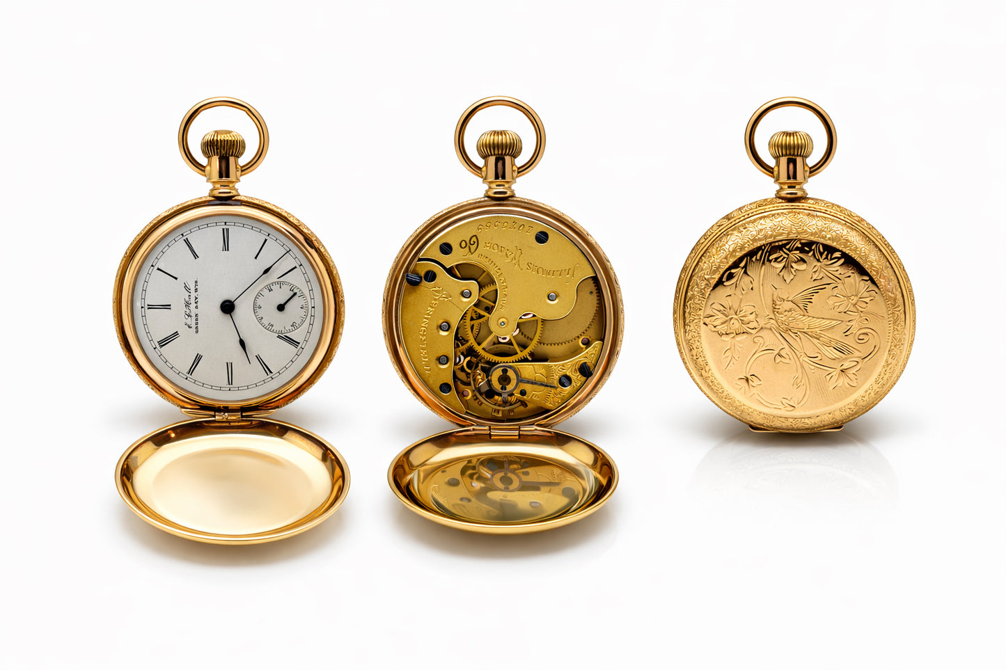 Three gold pocket watches with open faces on a white background