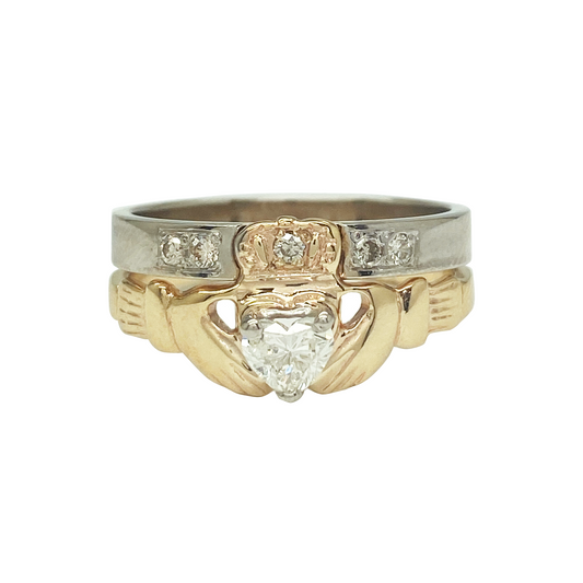 Two-tone gold diamond Claddagh ring set on a white backgorund