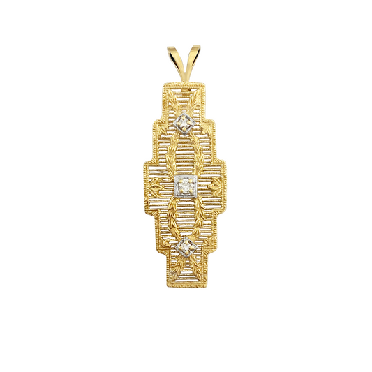 Gold pendant with a geometric design and three diamonds on a white background