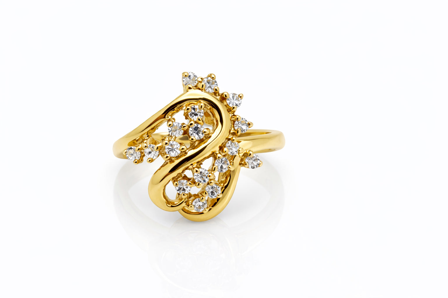 Gold ring with diamond accents on a white background