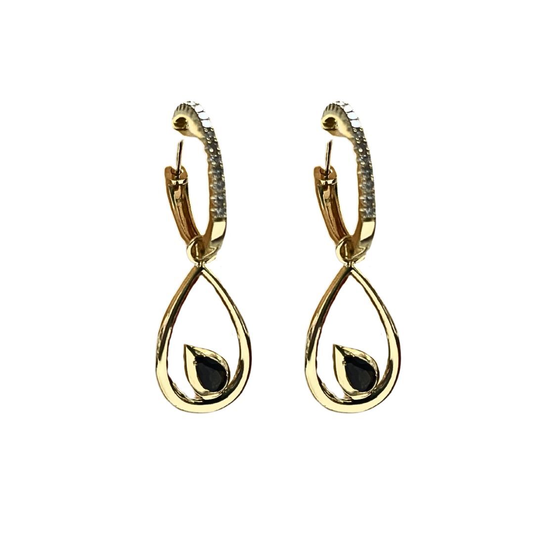 Gold hoop earrings with black gemstones on a white background
